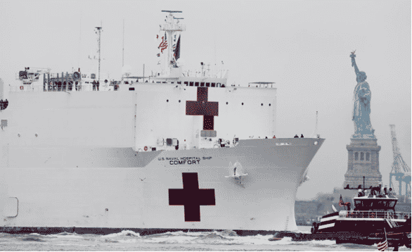 Photo of medical ship passing the Statue of Liberty