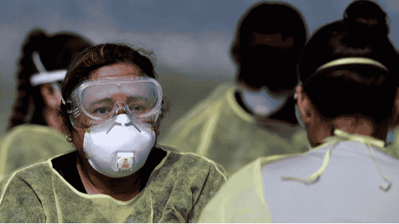 Medical workers in masks and goggles