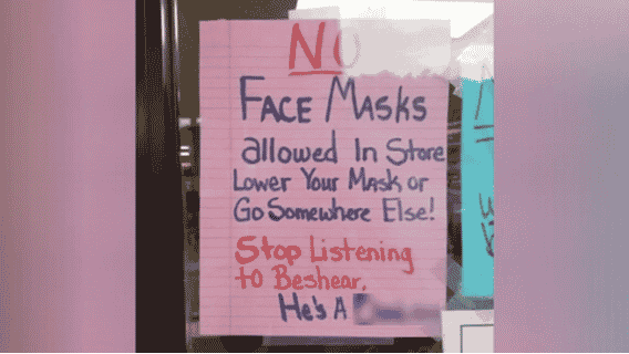 Sign that says no face masks are allowed in the store