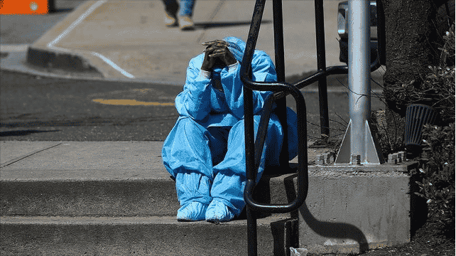 Hunched over medical worker